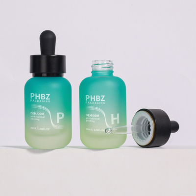 وفقًا لمتطلبات العميل، زجاجات قطارة مصل 30 مل زجاج مستديرة غير لامعة نوع غطاء زجاجة قطارة متين وخيار التعبئة والتغليف